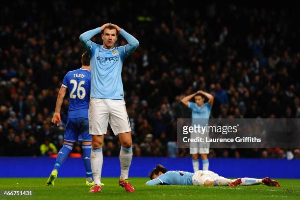 Edin Dzeko of Manchester City puts his hands on his heads after David Silva of Manchester City's misses a chance on goal during the Barclays Premier...