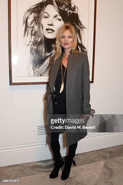 Kate Moss attends a private view of Bailey's Stardust, a exhibition of images by David Bailey supported by Hugo Boss, at the National Portrait...