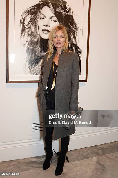 Kate Moss attends a private view of Bailey's Stardust, a exhibition of images by David Bailey supported by Hugo Boss, at the National Portrait...