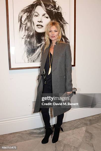 Kate Moss attends a private view of Bailey's Stardust, a exhibition of images by David Bailey supported by Hugo Boss, at the National Portrait...