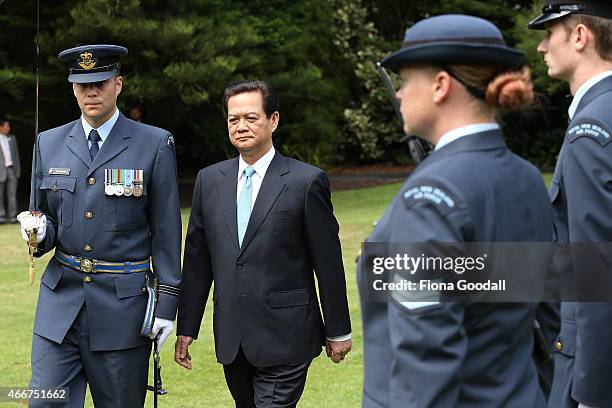 Vietnamese Prime Minister Nguyen Tan Dun inspects the guard of honour at Government House on March 19, 2015 in Auckland, New Zealand. The Vietnamese...