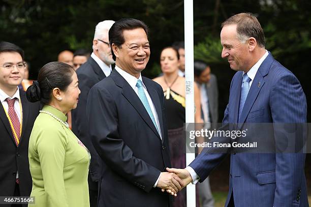 Vietnamese Prime Minister Nguyen Tan Dun and his wife Tran Thanh Kiem meet New Zealand Prime Minister John Key at Government House on March 19, 2015...