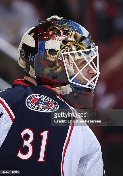 Goaltender Curtis McElhinney of the Columbus Blue Jackets during the NHL game against the Phoenix Coyotes at Jobing.com Arena on January 2, 2014 in...