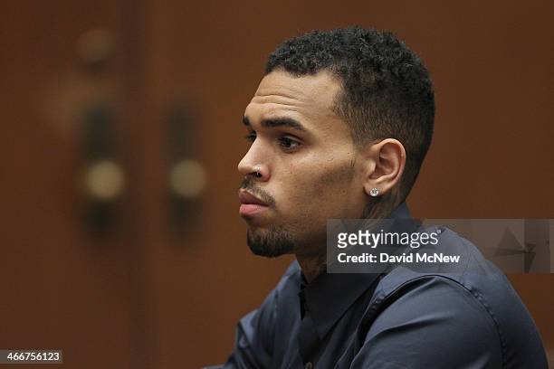 Singer Chris Brown appears in court for a probation progress hearing on February 3, 2014 in Los Angeles, California. Brown has been on probation...