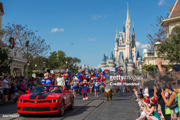In this handout photo provided by Disney Parks, Super Bowl XLVII MVP Malcolm Smith of the Seattle Seahawks participates in his parade at the Magic...