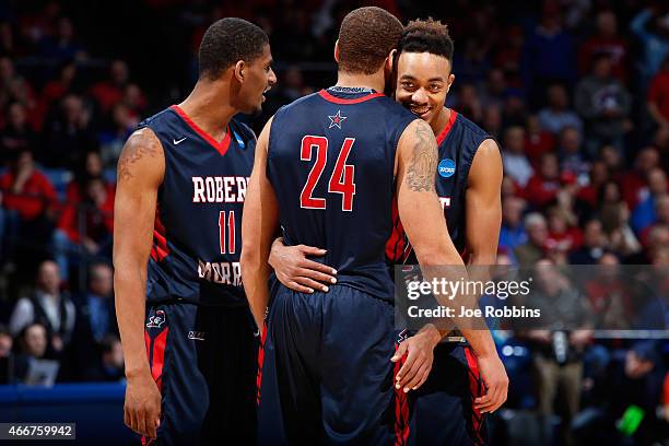 Marcquise Reed celebrates with Rodney Pryor and Aaron Tate of the Robert Morris Colonials against the North Florida Ospreys during the first round of...