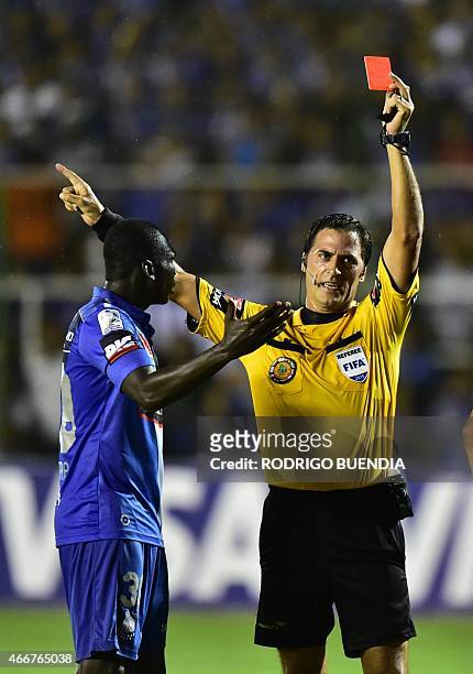 Argentinean referee Mauro Vigliardo shows the red card to Emelec's Osbaldo Lastra during the Emelec vs Internacional Copa Libertadores football match...