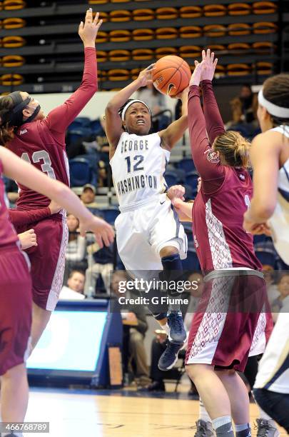 Danni Jackson of the George Washington Colonials drives to the hoop against the Saint Joseph's Hawks on January 22, 2014 at the Smith Center in...