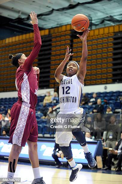 Danni Jackson of the George Washington Colonials drives to the hoop against the Saint Joseph's Hawks on January 22, 2014 at the Smith Center in...