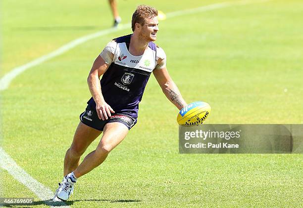 Colin Sylvia keeps the ball in play during a Fremantle Dockers AFL pre-season training session at Fremantle Oval on February 4, 2014 in Fremantle,...