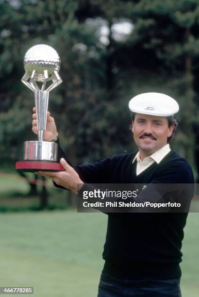 Mark McNulty of Zimbabwe with the trophy after winning the British Masters Golf Tournament held at the Woburn Golf Club, Buckinghamshire, 7th June...