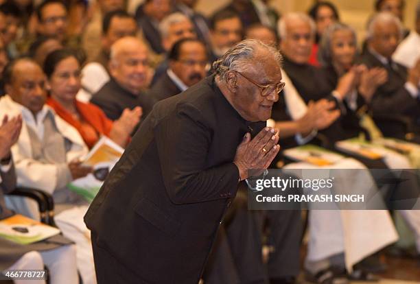 Indian scientist Chintamani Nagesa Ramachandra Rao greets Indian President Pranab Mukherjee prior to receiving the "Bharat Ratna" award during an...