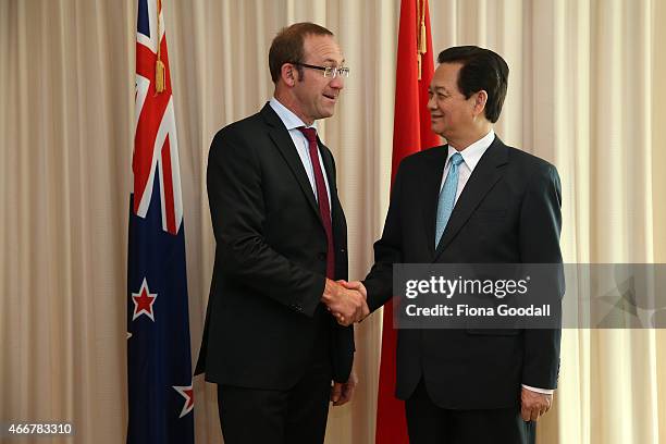 Vietnamese Prime Minister Nguyen Tan Dun shakes hands with New Zealand's Leader of the Opposition Andrew Little at Sky City Grand Hotel on March 19,...