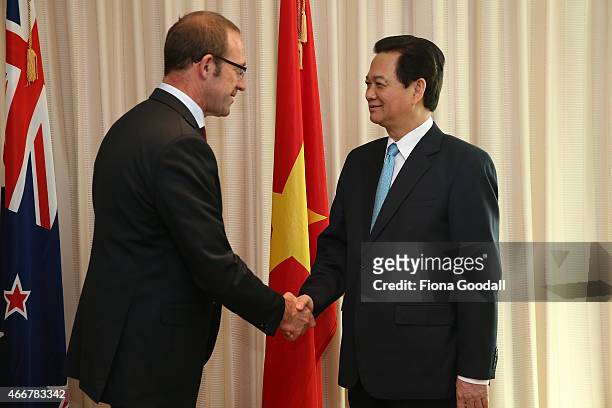 Vietnamese Prime Minister Nguyen Tan Dun shakes hands with New Zealand's Leader of the Opposition Andrew Little at Sky City Grand Hotel on March 19,...
