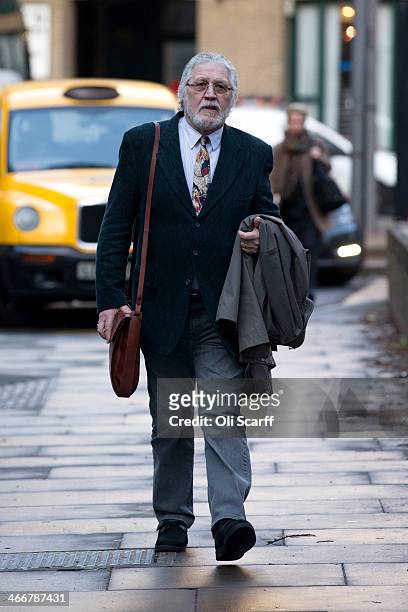 Radio presenter Dave Lee Travis arrives at Southwark Crown Court on February 4, 2014 in London, England. Dave Lee Travis, whose real name is David...