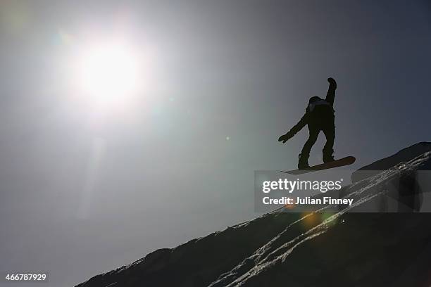 General view of a Slopestyle Snowboarder in action at Rosa Khutor Extreme Park prior to the Sochi 2014 Winter Olympics at the Mountain Cluster on...