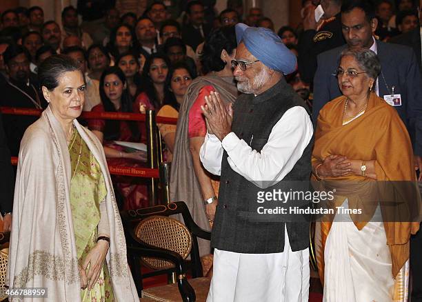 Prime Minister Manmohan Singh with his wife Gursharan Kaur greet UPA Chairperson and Congress President Sonia Gandhi at an awards ceremony at the...