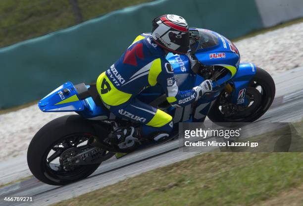 Randy De Puniet of France and Suzuki Test Team rounds the bend during the MotoGP Tests in Sepang - Day One at Sepang Circuit on February 4, 2014 in...
