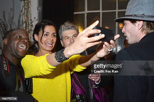 Laurence Roustandjee poses for a selfie with photographers the Basus Cocktail at Le Perchoir on March 18, 2015 in Paris, France.