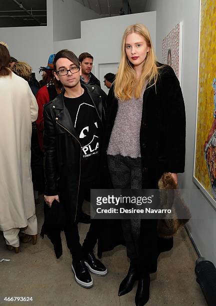 Designer Christian Siriano and model Jasmine Poulton attend Tali Lennox Exhibition Opening Reception at Catherine Ahnell Gallery on March 18, 2015 in...