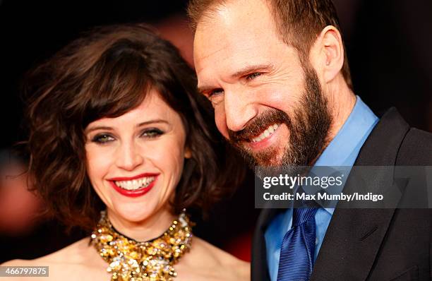 Felicity Jones and Ralph Fiennes attend the UK Premiere of 'The Invisible Woman' at Odeon Kensington on January 27, 2014 in London, England.