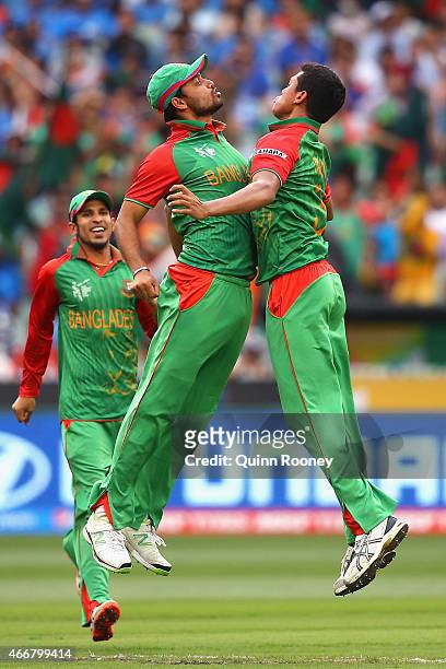 Taskin Ahmed of Bangladesh is congratulated by Mashrafe Mortaza after getting the wicket of Ajinkya Rahane of India during the 2015 ICC Cricket World...