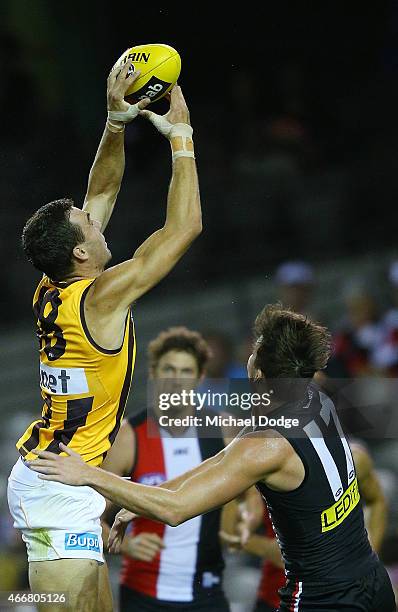 Jonathon Ceglar of the Hawks marks the ball against Dylan Roberton of the Saints during the NAB Challenge AFL match between St Kilda Saints and...