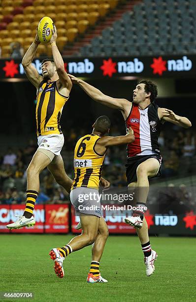 Jack Gunston of the Hawks marks the ball against Paddy McCartin of the Saints of the Saints during the NAB Challenge AFL match between St Kilda...