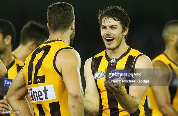 Isaac Smith of the Hawks reacts with James Frawley of the Hawks after their win during the NAB Challenge AFL match between St Kilda Saints and...