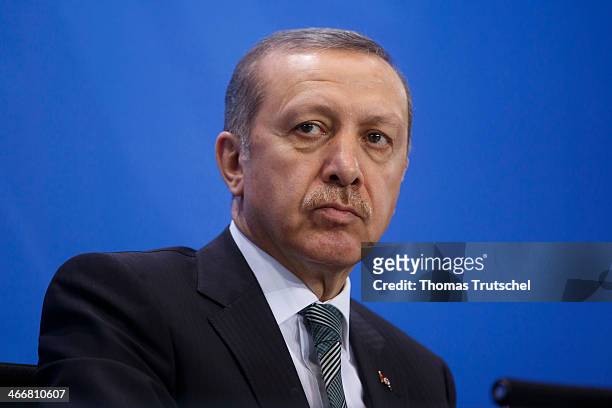 Turkish Prime Minister Recep Tayyip Erdogan speaks to the media following talks with German Chancellor Angela Merkel at the Chancellery on February...