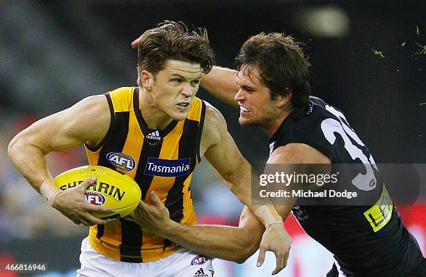 Taylor Duryea of the Hawks brushes off Cameron Shenton of the Saints during the NAB Challenge AFL match between St Kilda Saints and Hawthorn Hawks at...