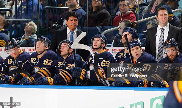 Interim head coach Ted Nolan and assistant head coach Joe Sacco of the Buffalo Sabres watch the action against the Florida Panthers on January 21,...