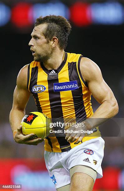 Luke Hodge of the Hawks looks upfield during the NAB Challenge AFL match between St Kilda Saints and Hawthorn Hawks at Etihad Stadium on March 19,...