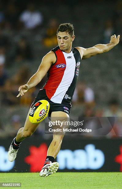 Darren Minchington of the Saints kicks the ball during the NAB Challenge AFL match between St Kilda Saints and Hawthorn Hawks at Etihad Stadium on...