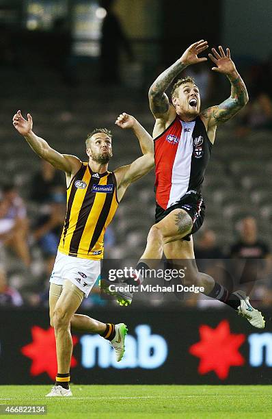Tim Membrey of the Saints marks the ball against Matt Suckling during the NAB Challenge AFL match between St Kilda Saints and Hawthorn Hawks at...