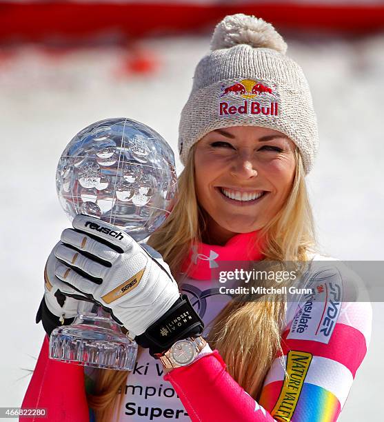 Lindsey Vonn of the USA with the trophy for overall Super G winner in the finish area of the FIS Alpine Ski World Cup women's Super-G race on March...