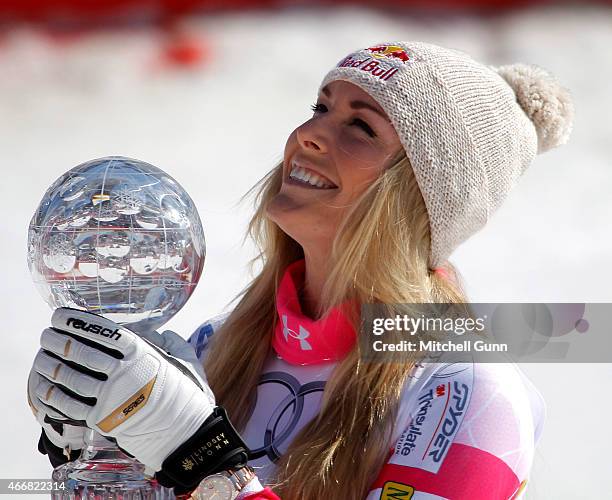 Lindsey Vonn of the USA with the trophy for overall Super G winner in the finish area of the FIS Alpine Ski World Cup women's Super-G race on March...