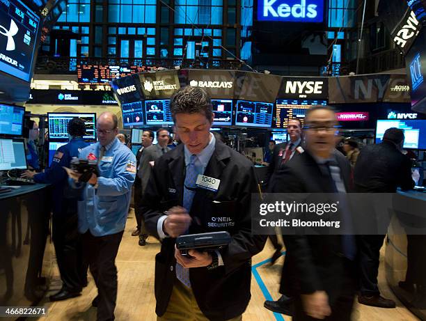 Traders work on the floor of the New York Stock Exchange in New York, U.S., on Tuesday, Feb. 4, 2014. U.S. Stocks rose, with the Standard & Poor's...