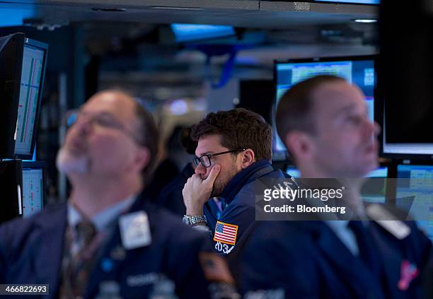 Traders work on the floor of the New York Stock Exchange in New York, U.S., on Tuesday, Feb. 4, 2014. U.S. Stocks rose, with the Standard & Poor's...