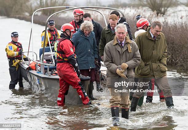 Prince Charles, Prince of Wales returns in a police boat after visiting a flood hit community on the Somerset Levels on February 4, 2014 in...