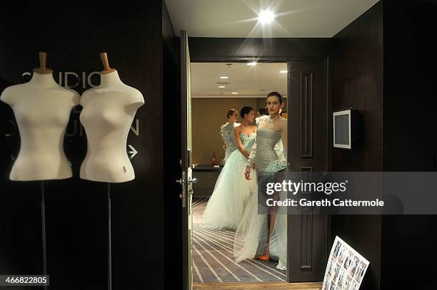 Models backstage before the Tony Yaacoub show as part of Paris Fashion Week Haute-Couture Spring/Summer 2014 at the W Hotel on January 22, 2014 in...