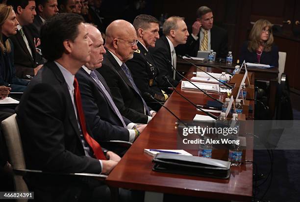 Director James Comey, Central Intelligence Agency Director John Brennan, Director of National Intelligence James Clapper, Lt. Gen. Michael Flynn,...