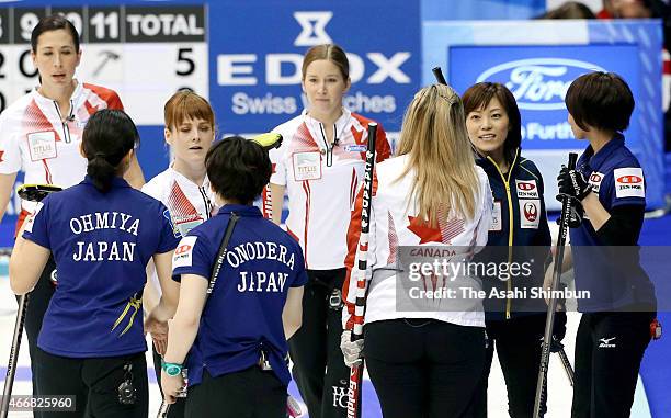 Members of Japan and Canada shake hands after a round-robin match between Japan and Canada during day six of the World Women's Curling Championship...