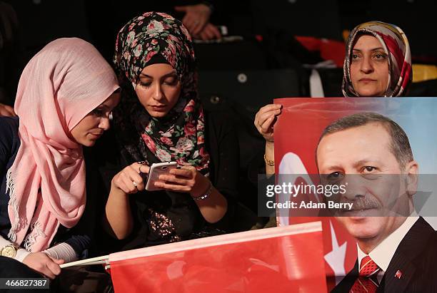 Supporters of Turkish Prime Minister Recep Tayyip Erdogan attend a rally at Tempodrom hall on February 4, 2014 in Berlin, Germany. Turkey will soon...