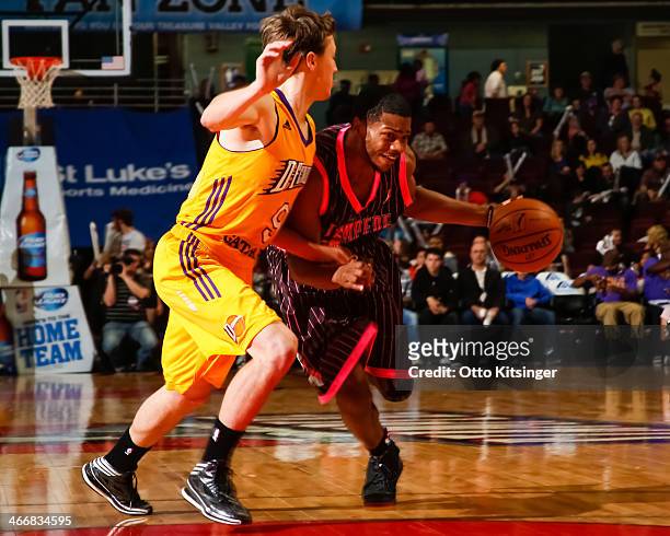 Dexter Strickland of the Idaho Stampede drives the ball past Josh Magette of the Los Angeles D-Fenders during an NBA D-League game on February 1,...