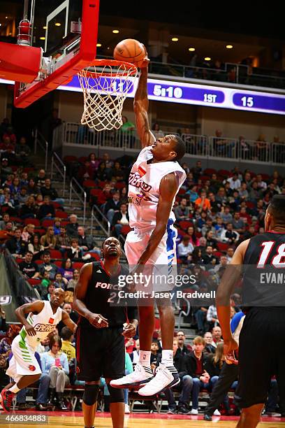 Austin Freeman of the Iowa Energy dunks as Henry Walker of the Sioux Falls Skyforce watches in an NBA D-League game on February 1, 2014 at the Wells...