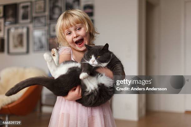 happy girl with cat - kids pets stock pictures, royalty-free photos & images