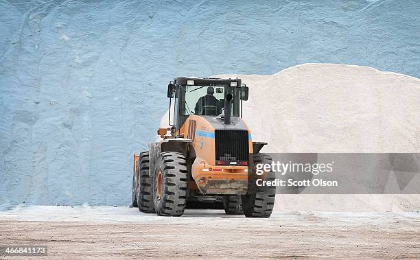 Streets and Sanitation worker grooms a pile of road salt as the city makes preparations for another winter storm on February 4, 2014 in Chicago,...