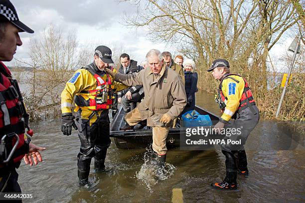 Prince Charles, Prince of Wales arrives at the flood hit village of Muchelney, where he met residents affected by flooding on February 4, 2014 in...