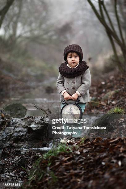 Little Boy With Big Clock, Foto de stock